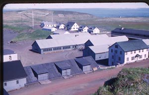 Photo of a group of white buildings. The coal house is in the center of the photo.